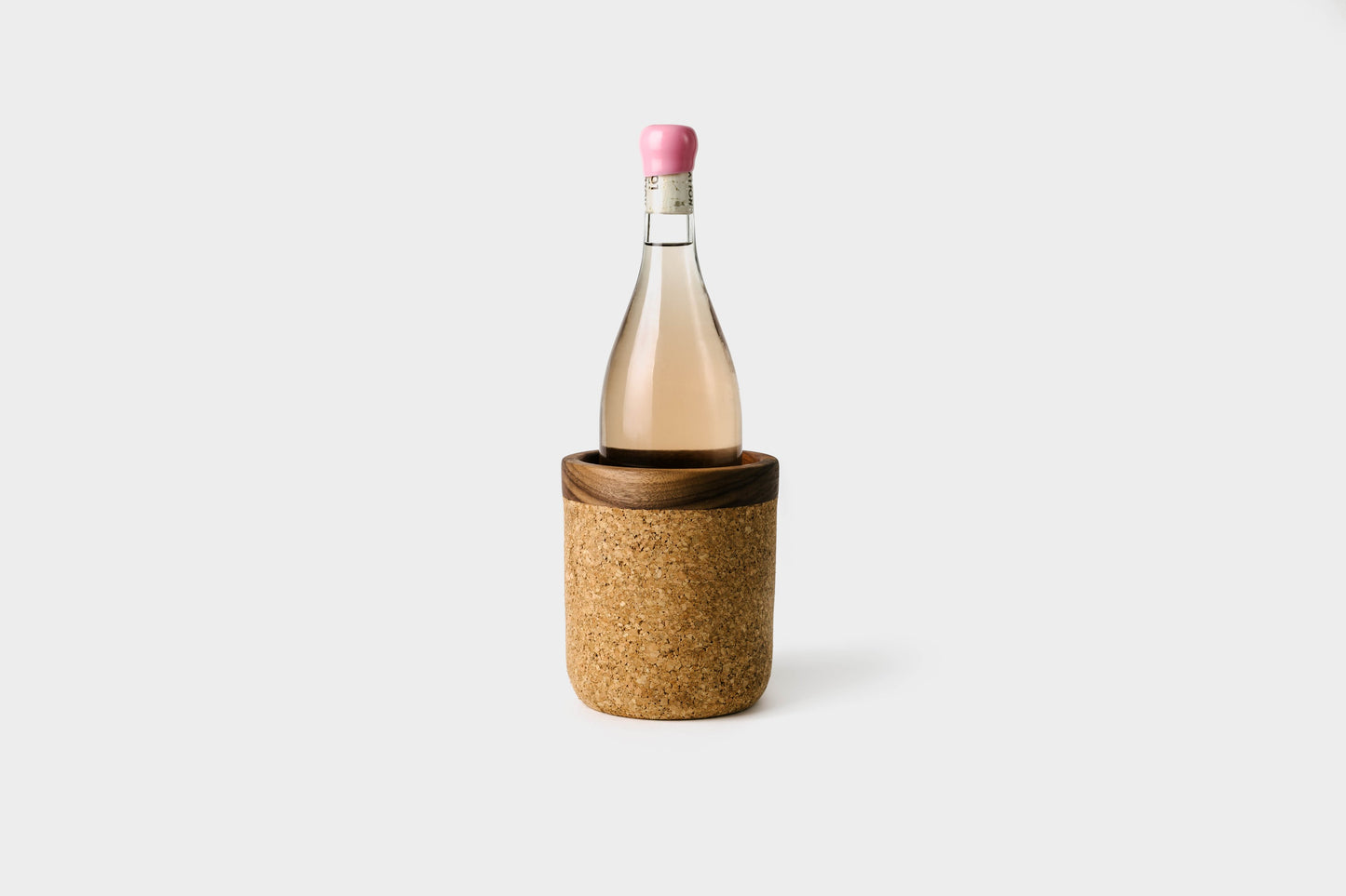 Cork wine cooler in the natural cork and walnut trim. With rose bottle inside. By Melanie Abrantes Designs.