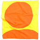 Orange/yellow cloth layed out to see the circle and half circle design.