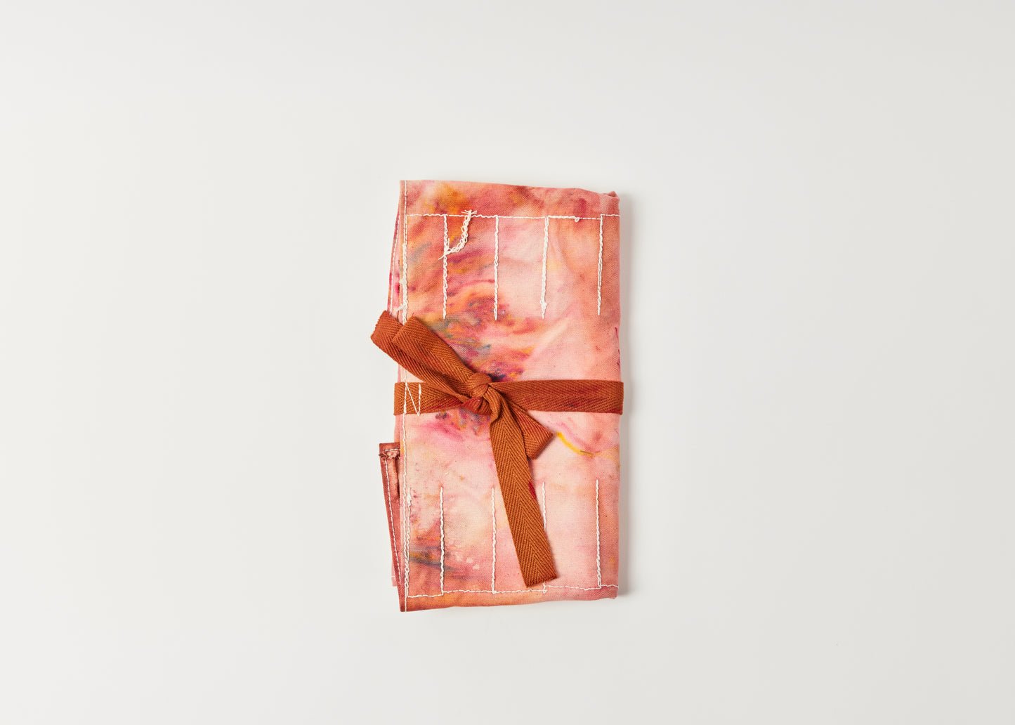 Hand-dyed tool roll in crimson by Melanie Abrantes Designs.