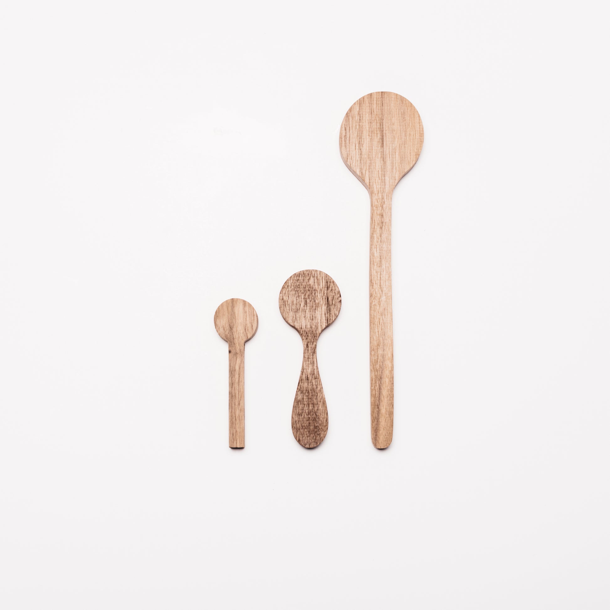 Regular, coffee, and cooking spoons in Walnut wood. By Melanie Abrantes Designs.