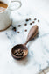 Finished walnut coffee spoon by Melanie Abrantes Designs.