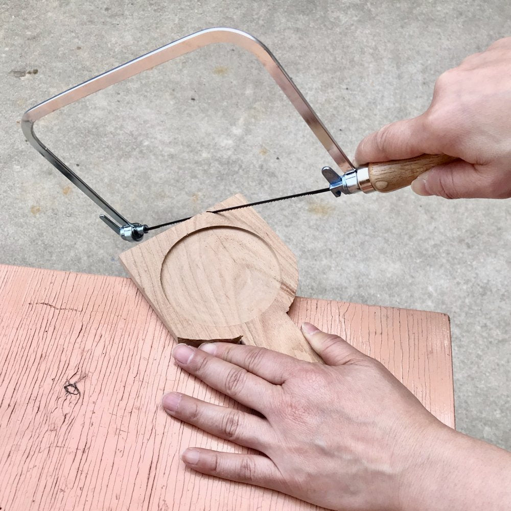 Person sawing blank from DIY Mirror Carving Kit | Melanie Abrantes Designs