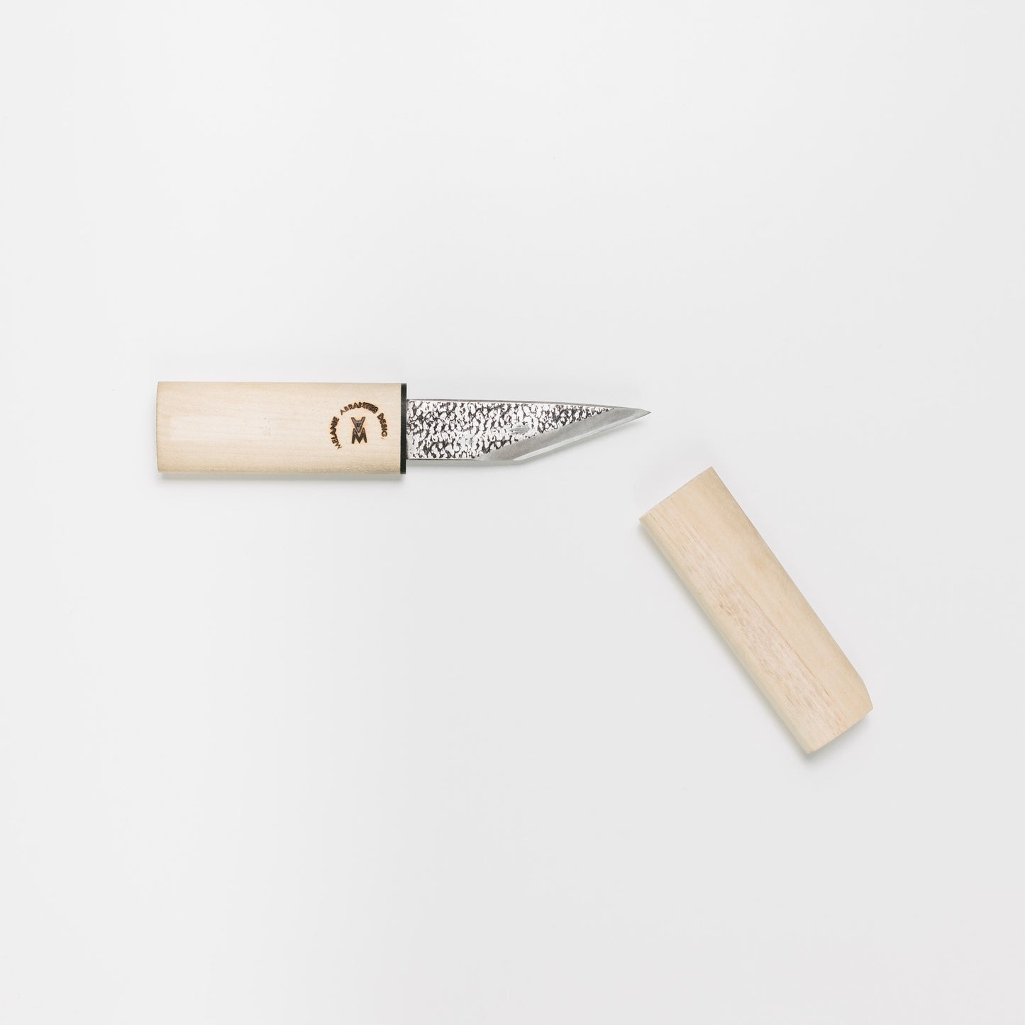 Carving knife shown with the cover off, exposing the blade. Depicted is the beveled edge on one side to give an extremely fine cut.