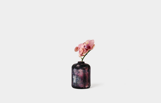 Bud vase in midnight with purple orchid inside | Melanie Abrantes Designs