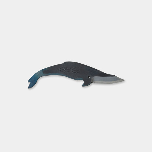 Kujira Knife in the shape of a humpback Whale. Blue tail, with a grey body. The knife portion takes the shape of the mouth of the whale. Bladesmith Satoshi Yamashita