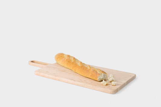 Maple Bread Board with a baguette showing the large surface area.