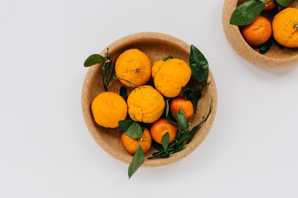 Large Natural Cork Bowl holding oranges | Melanie Abrantes Designs