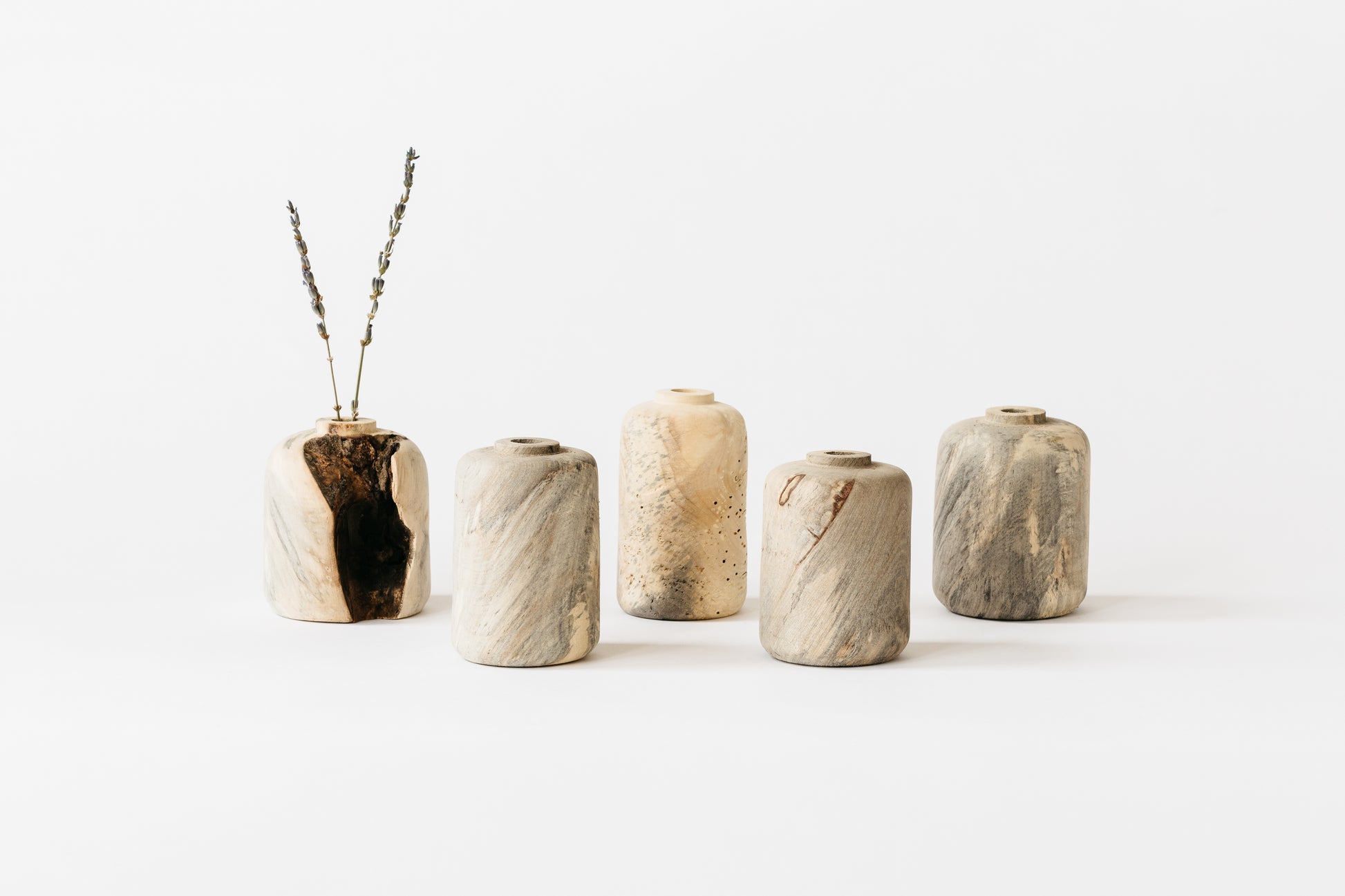 Buckeye Burl Vases showing the one-of-a-kind shapes and sizes they come in.