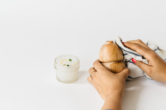 Melanie Abrantes Designs' 4oz wood butter applied on our double bud cherry vase. Resulting in a polished look.