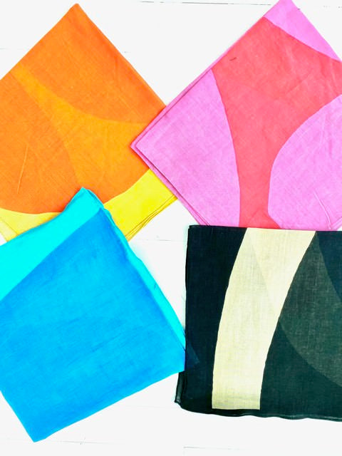 Furoshiki Reusable Gift Wrapping Cloth by Donna Gorman of See Design. All four colors shown folded into squares.