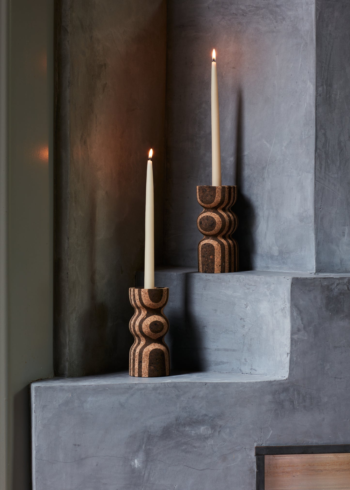 Anni Tall Striped Cork Candle Holders shown elegantly on a fireplace mantel. Handmade by Melanie Abrantes Designs.