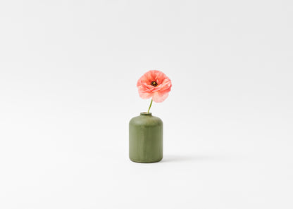 Bud vase sage green with pink flower. By Melanie Abrantes Designs.