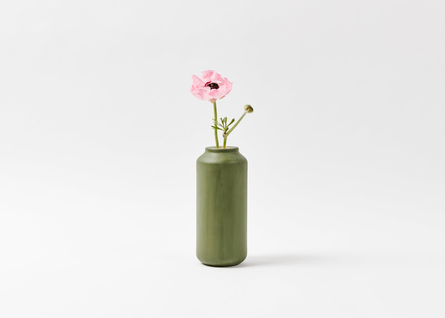Tall & Wide vase hand painted in sage green. The vase has a pink flower inside with a white background. By Melanie Abrantes Designs.
