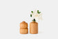Double bud cherry vase and straight bud vase with white flower.