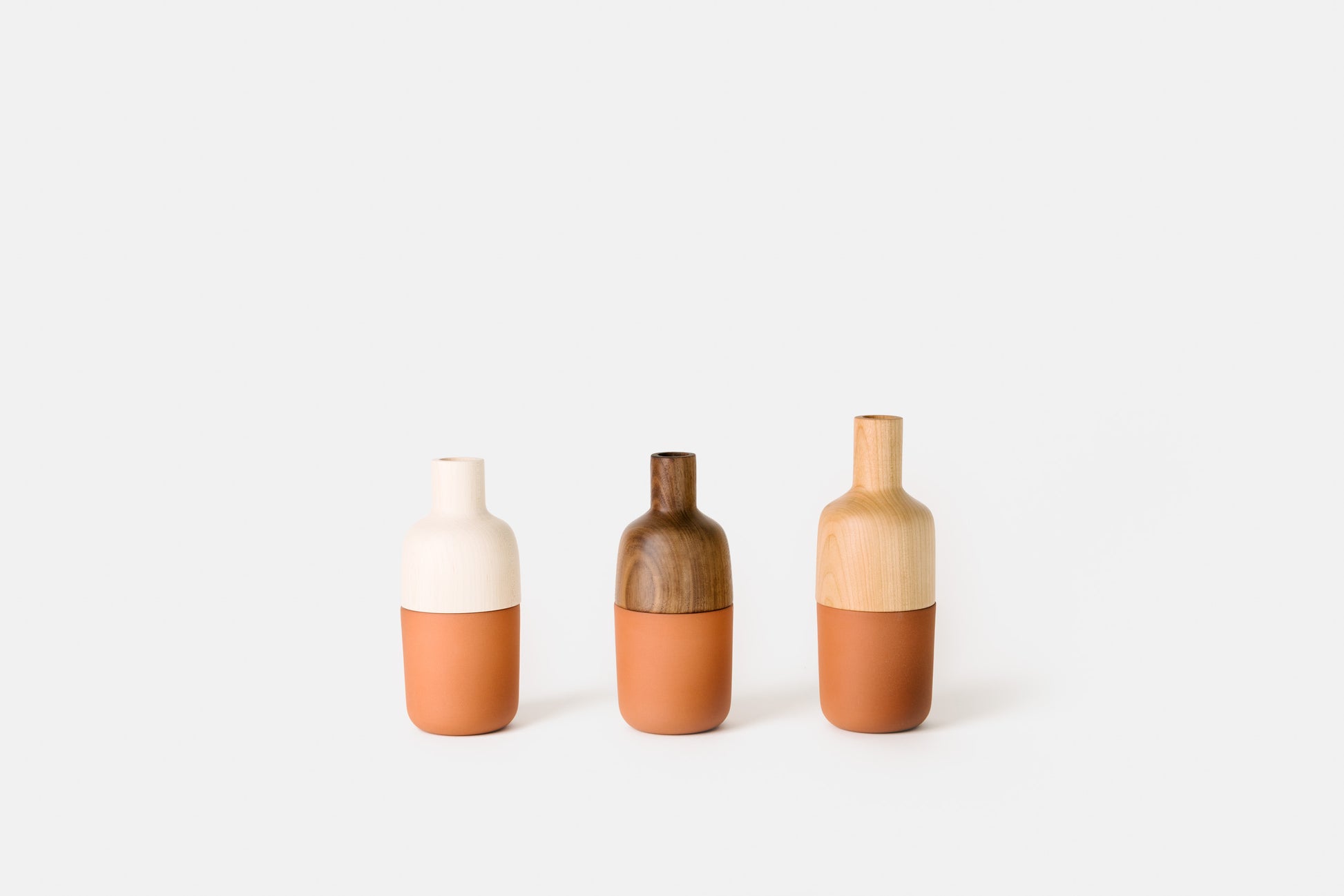 Hardwood and terracotta marais vases by Melanie Abrantes Designs.