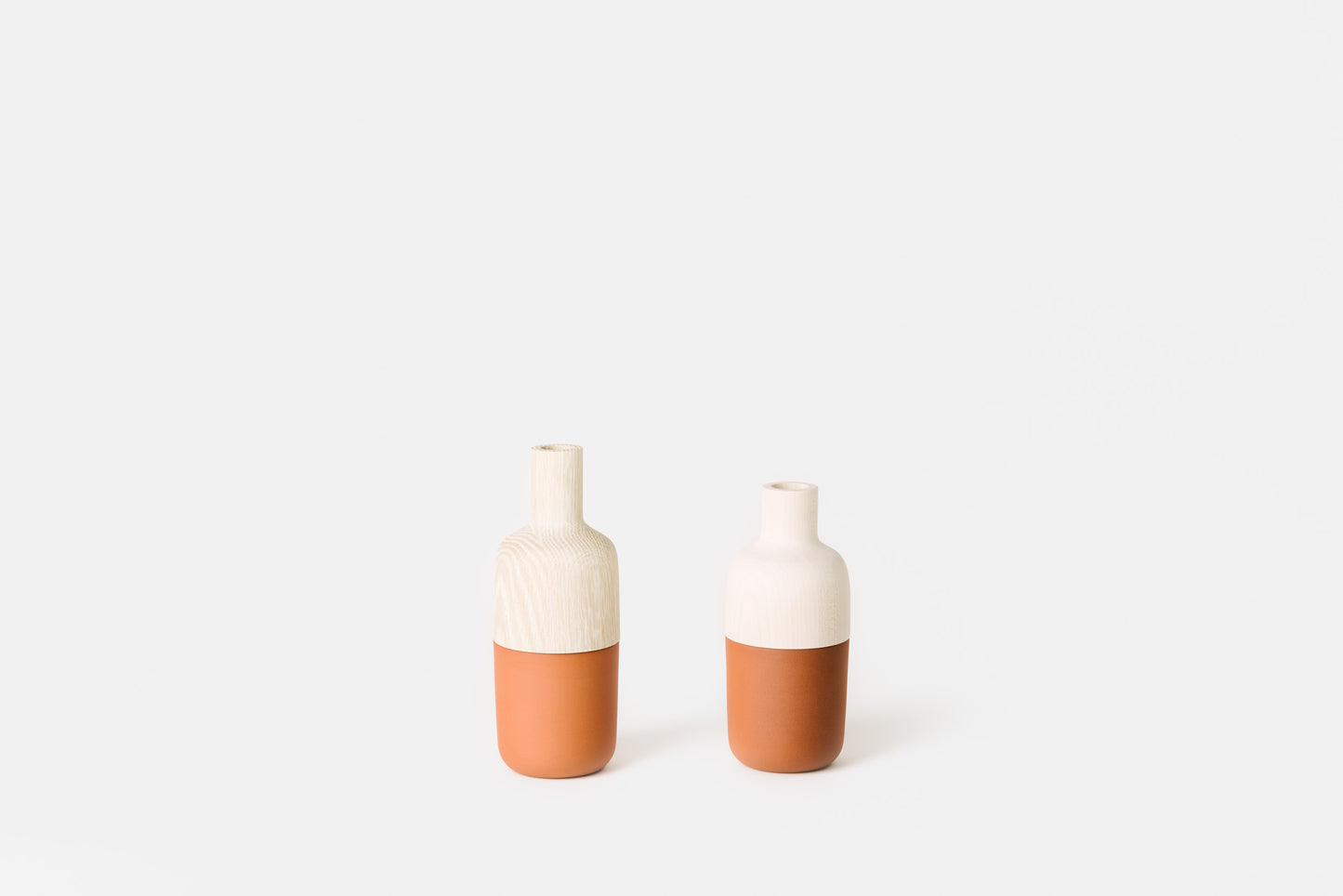 Bleached wood and terracotta marais vases by Melanie Abrantes Designs.