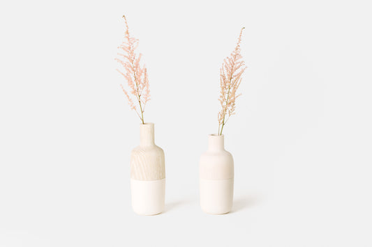 Bleached Oak and Bleached Maple marais vases with white ceramic bottoms.