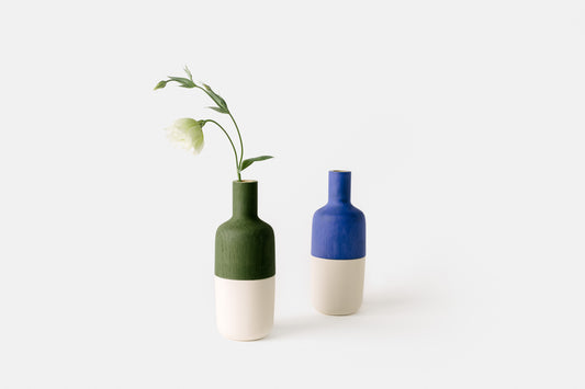 Painted oak marais vases in green and blue with white ceramic bottoms.