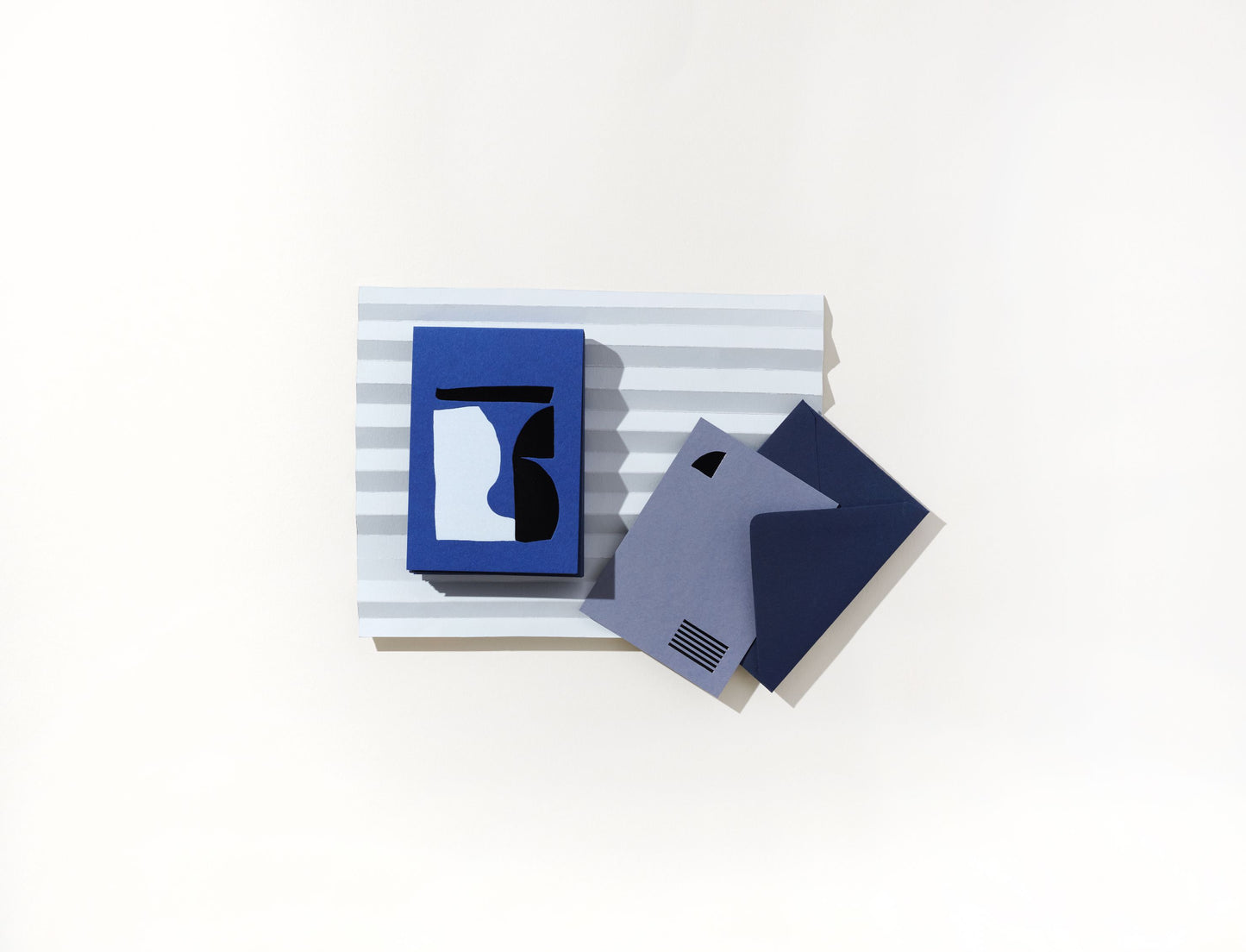 Beluga Mini Note + Envelope Set by Moglea. Set of 12 flat cards and envelopes in small size, blue with black and white foil.