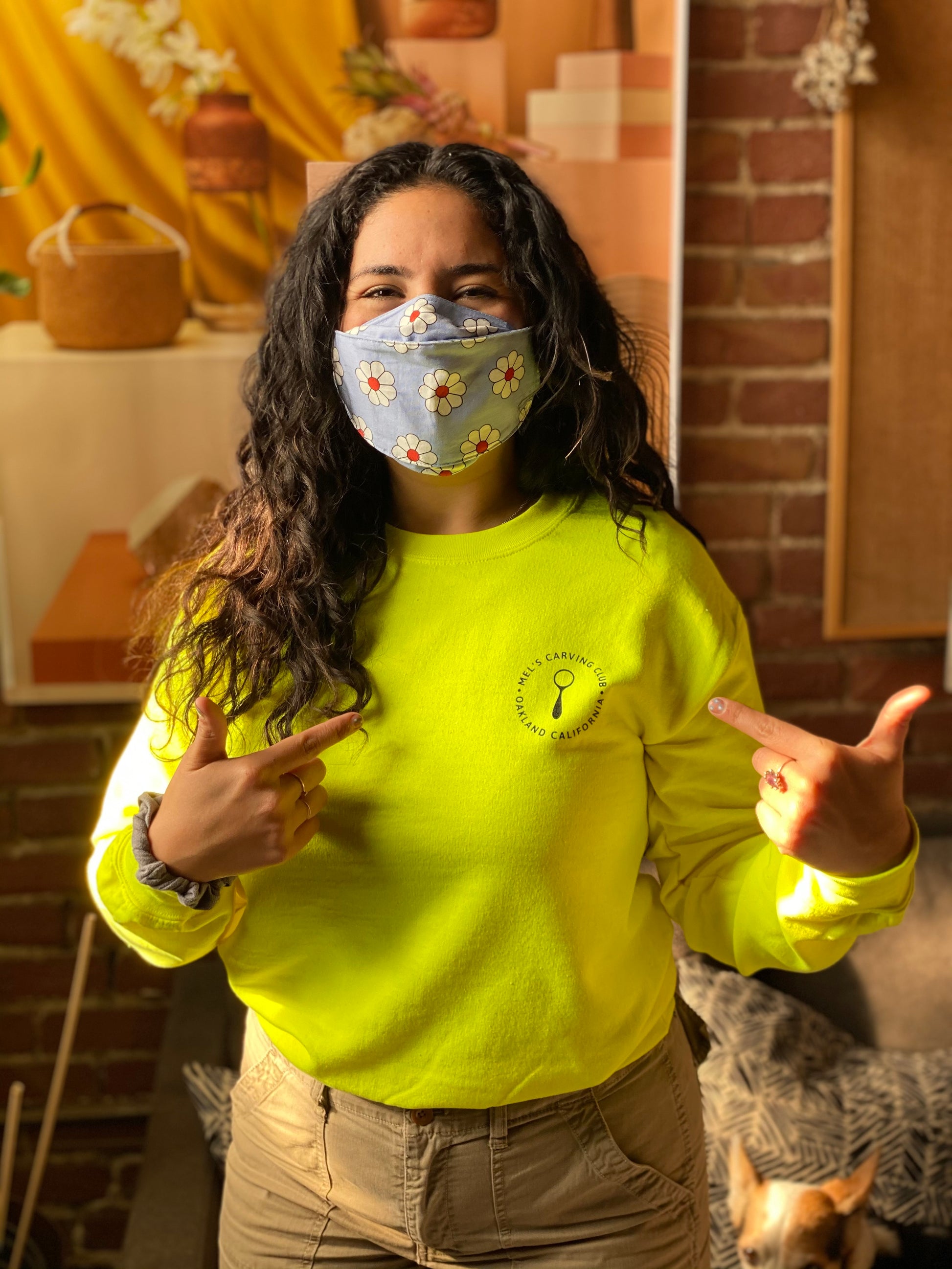 Melanie wearing Neon Yellow Mel's Carving Club Sweatshirt with Logo on Chest | Melanie Abrantes Designs