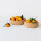 Natural Cork Bowls holding oranges. In Large (left) and Small (right) | Melanie Abrantes Designs